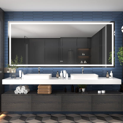 Modern bathroom with a large mirror, sink, and decorative elements.