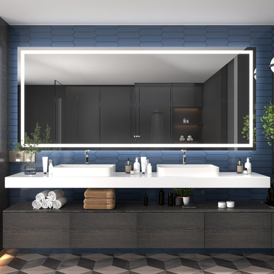 Modern bathroom with a large mirror, sink, and decorative elements.