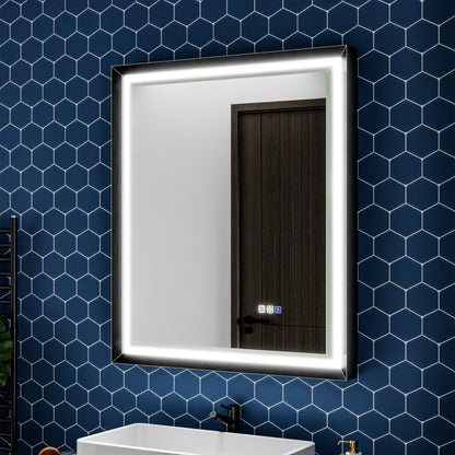 Bathroom with a illuminated mirror on a blue tiled wall