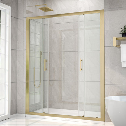 Gold-framed shower enclosure in a bathroom with tiled walls and a window.