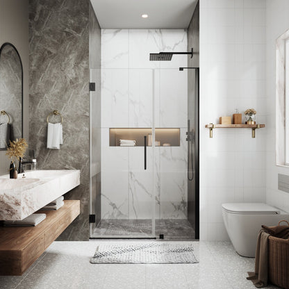 Modern bathroom with glass shower enclosure, marble walls, and wooden bench.
