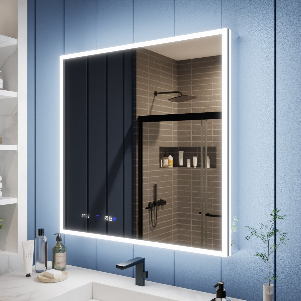 A modern wall-mounted bathroom mirror with a bright white LED light frame, installed above a white sink. The mirror reflects a tiled shower area, and the wall behind it is blue paneled.