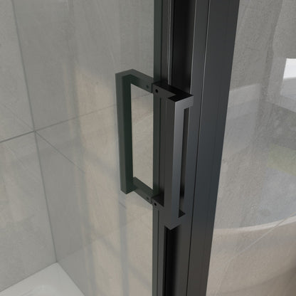 Black shower door handle on a glass panel with tiled wall background