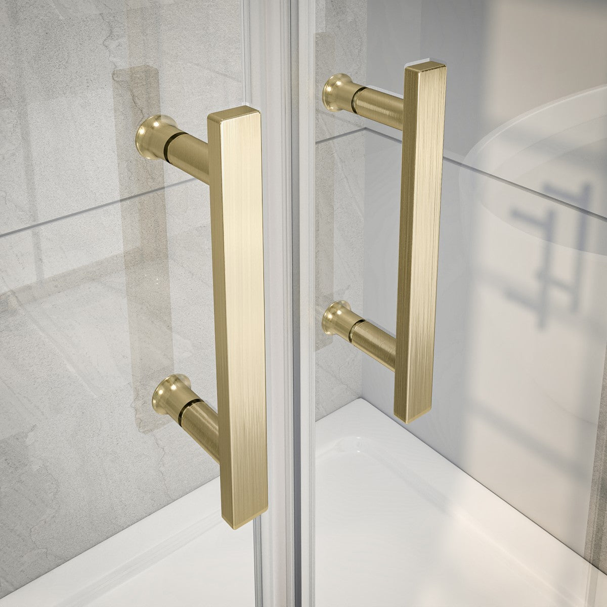 Gold shower door handles on a glass shower enclosure