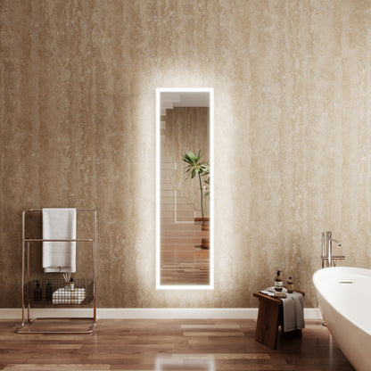 Bathroom with a large illuminated mirror, towel rack, and bathtub.