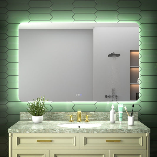 Bathroom vanity with a large mirror, sink, and decorative elements against a green tiled wall.