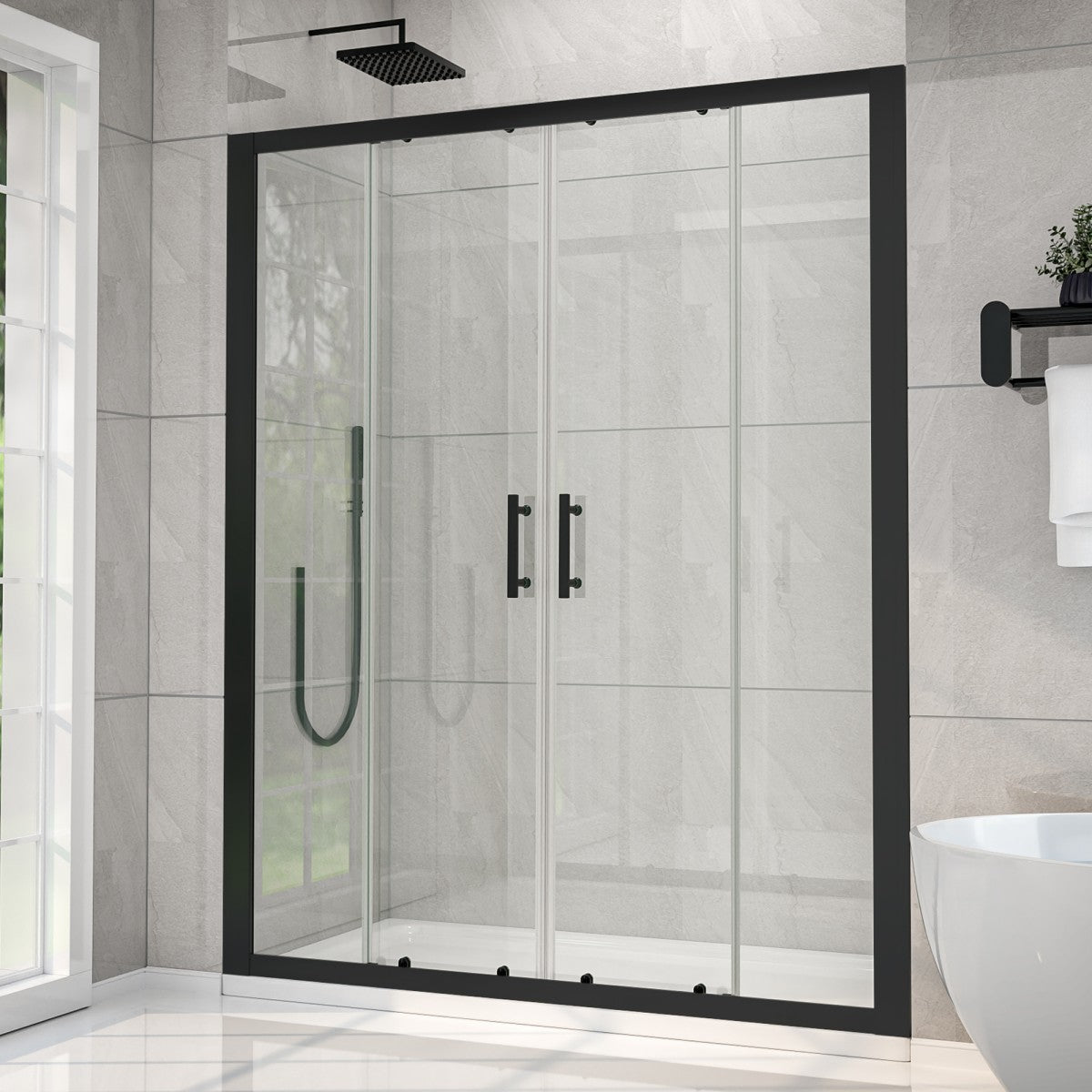 Modern shower enclosure with black frame and fixtures in a bathroom setting.