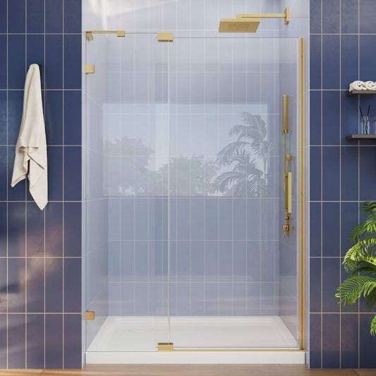 Modern glass shower enclosure with gold fixtures in a bathroom setting.