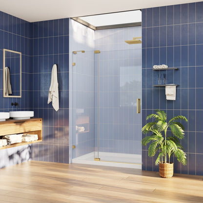 Modern bathroom with blue tiled walls, glass shower enclosure, wooden shelf, and plant.